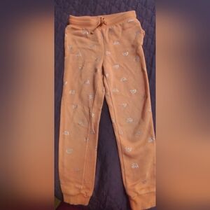H&M-Used-Kids Peach Joggerswith Silver Rainbow Print.